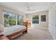 Comfortable bedroom with large windows offering natural light and views of the surrounding greenery at 1426 75Th Ne Cir, St Petersburg, FL 33702