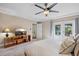 Comfortable bedroom with TV, access to patio, and ensuite bathroom at 1426 75Th Ne Cir, St Petersburg, FL 33702