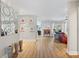Bright entryway featuring wood floors, decorative vases, and modern wall art at 1426 75Th Ne Cir, St Petersburg, FL 33702