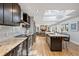 Elegant kitchen with a large island, stainless steel appliances, and a cozy breakfast nook at 1426 75Th Ne Cir, St Petersburg, FL 33702