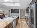 Bright kitchen with a skylight, granite counters, and stainless steel appliances at 1426 75Th Ne Cir, St Petersburg, FL 33702