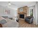 Inviting living room with stone fireplace, comfortable seating, and modern decor at 1426 75Th Ne Cir, St Petersburg, FL 33702
