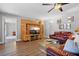 Relaxing living room with wood floors, media center, and stylish modern furniture at 1426 75Th Ne Cir, St Petersburg, FL 33702