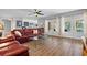 Comfortable living room featuring wood floors, stylish furniture, and French door access to the patio at 1426 75Th Ne Cir, St Petersburg, FL 33702