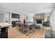 Open floor plan with fireplace, adjacent to dining area, and modern finishes at 1426 75Th Ne Cir, St Petersburg, FL 33702