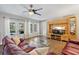 Relaxing living room boasts a ceiling fan, stylish furniture, and French door access to the pool at 1426 75Th Ne Cir, St Petersburg, FL 33702