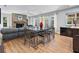 Living room area featuring a stone fireplace and natural light from the windows at 1426 75Th Ne Cir, St Petersburg, FL 33702