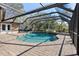 Inviting pool area with a screened enclosure, creating a private and relaxing outdoor oasis at 1426 75Th Ne Cir, St Petersburg, FL 33702