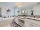 Elegant primary bathroom features double sinks, granite countertops, soaking tub, and a separate walk-in shower at 16082 Sonoma Grove Cir, Tampa, FL 33647