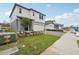 Well-maintained two-story home featuring a two-car garage and manicured landscaping at 1855 Brekey Way, Zephyrhills, FL 33541