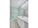 Bathroom featuring a vanity, toilet, mirror, and shower-tub combination with floral shower curtain at 19029 Us Highway 19 N # 1-22, Clearwater, FL 33764