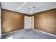 Bedroom featuring neutral colored walls, carpet, a closet, and access to another room at 19029 Us Highway 19 N # 1-22, Clearwater, FL 33764