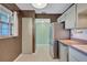 A cozy kitchen featuring stainless steel appliances, tiled floor, and ample cabinet space at 19029 Us Highway 19 N # 1-22, Clearwater, FL 33764