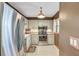 Kitchen with stainless steel appliances, tile flooring, overhead lighting and light colored cabinets at 19029 Us Highway 19 N # 1-22, Clearwater, FL 33764
