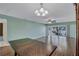 Inviting dining room open to a large living area with wood floors and balcony access at 19029 Us Highway 19 N # 1-22, Clearwater, FL 33764