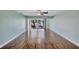 Spacious living room featuring beautiful wood floors and a ceiling fan at 19029 Us Highway 19 N # 1-22, Clearwater, FL 33764