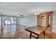 Open-concept living and dining area with hardwood floors, a ceiling fan, and sliding glass doors at 19029 Us Highway 19 N # 1-22, Clearwater, FL 33764