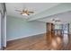 Bright and airy living space featuring stylish wood flooring and ceiling fans at 19029 Us Highway 19 N # 1-22, Clearwater, FL 33764