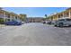 The parking area is surrounded by a beige building, providing ample space for residents and visitors at 19029 Us Highway 19 N # 1-22, Clearwater, FL 33764