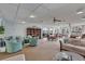 Inviting social room with comfortable seating, bookshelves, and a view of the canal at 19029 Us Highway 19 N # 1-22, Clearwater, FL 33764