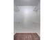 Empty walk-in closet features wire shelving and carpeted floor at 19029 Us Highway 19 N # 1-22, Clearwater, FL 33764