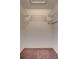 Empty walk-in closet features wire shelving and carpeted floor at 19029 Us Highway 19 N # 1-22, Clearwater, FL 33764
