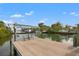 Dock with seating, boat lift and direct access to the canal and open water at 1936 Arrowhead Ne Dr, St Petersburg, FL 33703