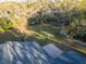 Aerial view showcasing lush backyard and the serene surroundings of the property at 19531 Deer Lake Rd, Lutz, FL 33548