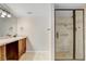 Bathroom with glass shower, granite vanity, and neutral tile flooring at 19531 Deer Lake Rd, Lutz, FL 33548
