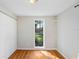 Bedroom featuring hardwood floors, a window view, and a closet at 19531 Deer Lake Rd, Lutz, FL 33548