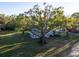 Exterior shot of a house with a very large tree in the front yard at 19531 Deer Lake Rd, Lutz, FL 33548