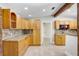 Traditional kitchen with custom wood cabinetry and granite countertops at 19531 Deer Lake Rd, Lutz, FL 33548