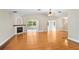 Spacious living room with hardwood floors, fireplace, and archways leading to other rooms, showing an open layout at 19531 Deer Lake Rd, Lutz, FL 33548