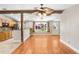 Open concept living space featuring hardwood floors and a tropical ceiling fan at 19531 Deer Lake Rd, Lutz, FL 33548