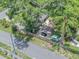 An aerial view of the home showcasing landscaping, roof, and surrounding trees at 2412 Giddens Ave, Seffner, FL 33584