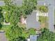 Bird's eye view of home showcasing the backyard, landscaping and roof details at 2412 Giddens Ave, Seffner, FL 33584