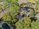 Aerial view showcases a private backyard oasis with brick patio, a pergola, and an in-ground pool at 2412 Giddens Ave, Seffner, FL 33584