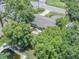 Aerial view of backyard, featuring trees, outdoor living space and pool at 2412 Giddens Ave, Seffner, FL 33584