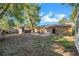 View of the backyard featuring a patio, some shade, and a covered outdoor kitchen or bar area at 2412 Giddens Ave, Seffner, FL 33584