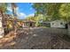 Spacious backyard with a brick patio, storage shed, and mature trees at 2412 Giddens Ave, Seffner, FL 33584