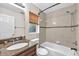 Bathroom featuring a granite countertop, bathtub, shower and neutral tilework at 2412 Giddens Ave, Seffner, FL 33584