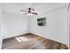 A well-lit bedroom features luxury vinyl plank flooring, neutral paint and a ceiling fan at 2412 Giddens Ave, Seffner, FL 33584