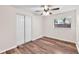 Clean bedroom with modern wood-look floors, a window for natural light, and a closet at 2412 Giddens Ave, Seffner, FL 33584