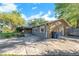 Property exterior showing a spacious paved driveway, beautiful stone accents, and attractive landscaping at 2412 Giddens Ave, Seffner, FL 33584