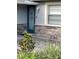 Close-up of a detailed front door with decorative glass and stone veneer at 2412 Giddens Ave, Seffner, FL 33584