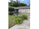 Charming single-story home with a well-manicured lawn and stone accents at 2412 Giddens Ave, Seffner, FL 33584