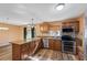 Updated kitchen with stainless steel appliances, granite countertops, mosaic backsplash, and an island for food preparation at 2412 Giddens Ave, Seffner, FL 33584