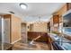 Kitchen with granite countertops, stainless steel appliances, and wood cabinets at 2412 Giddens Ave, Seffner, FL 33584
