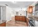 Functional kitchen showcasing stainless steel appliances, wooden cabinets, and granite countertops at 2412 Giddens Ave, Seffner, FL 33584