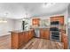 Spacious kitchen featuring stainless steel appliances and wood cabinets, offering a modern design at 2412 Giddens Ave, Seffner, FL 33584